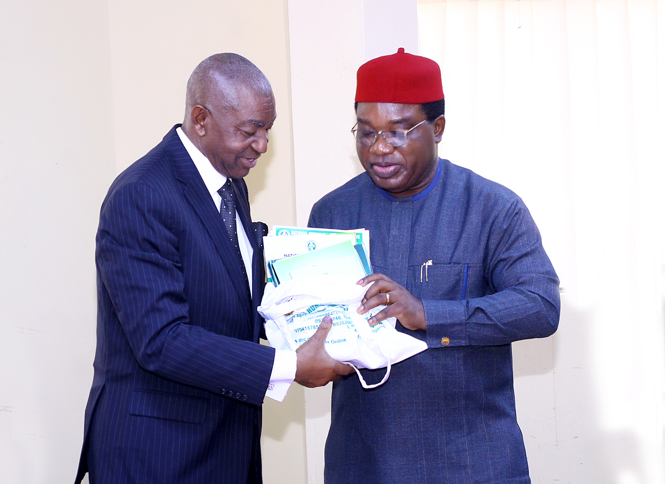 Chief Solomon Akuma SAN Reciveing gift from the ES