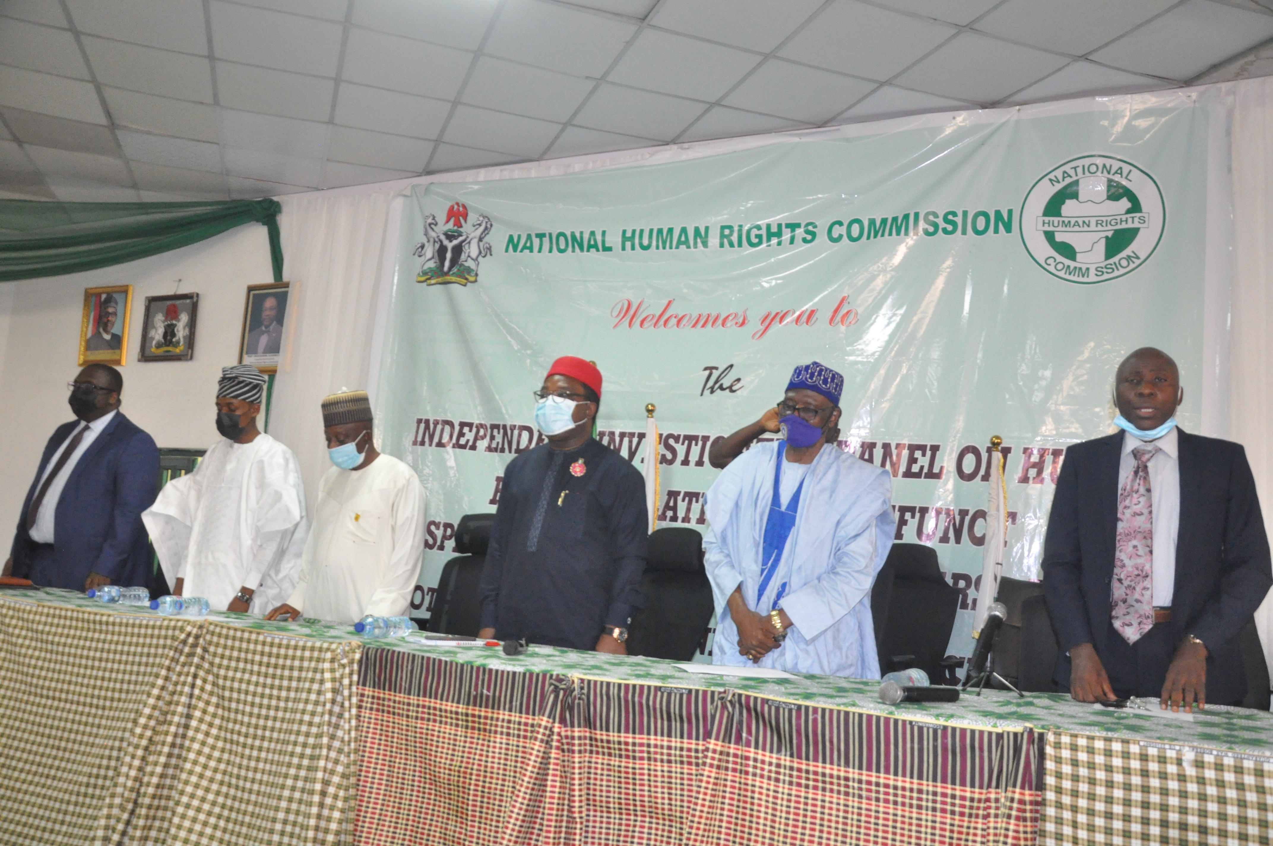 nhrc-es-and-panel-members-stand-for-the-national-anthem