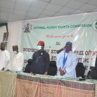 nhrc-es-and-panel-members-stand-for-the-national-anthem
